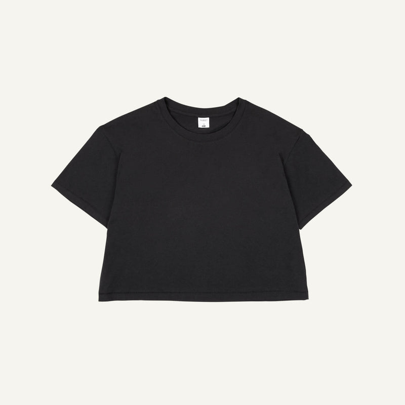 An organic cotton boxy tee in graphite gray color on a plain background.