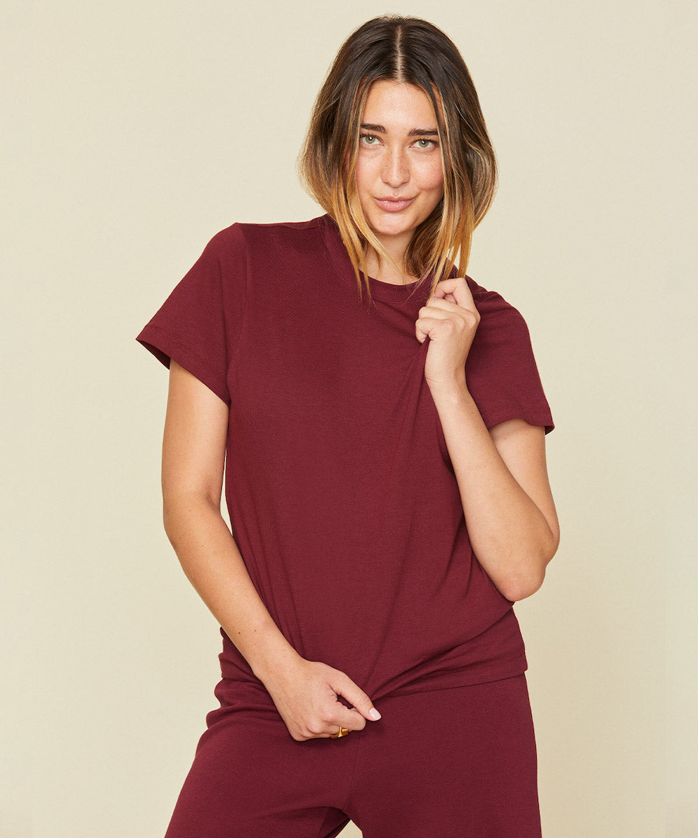 Woman wearing the classic tee in garnet red color.