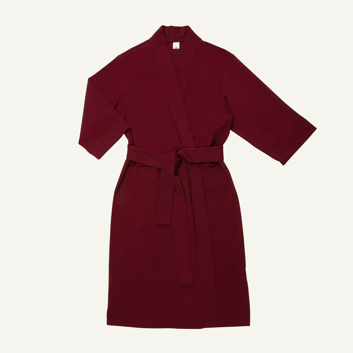 An essential robe in garnet red color.