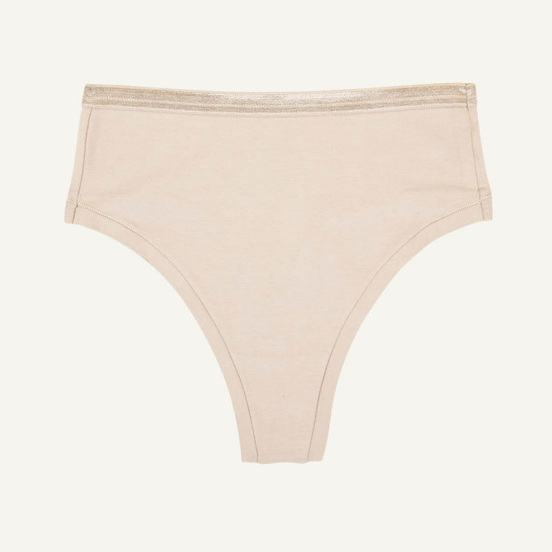 A high rise thong in stone beige color.