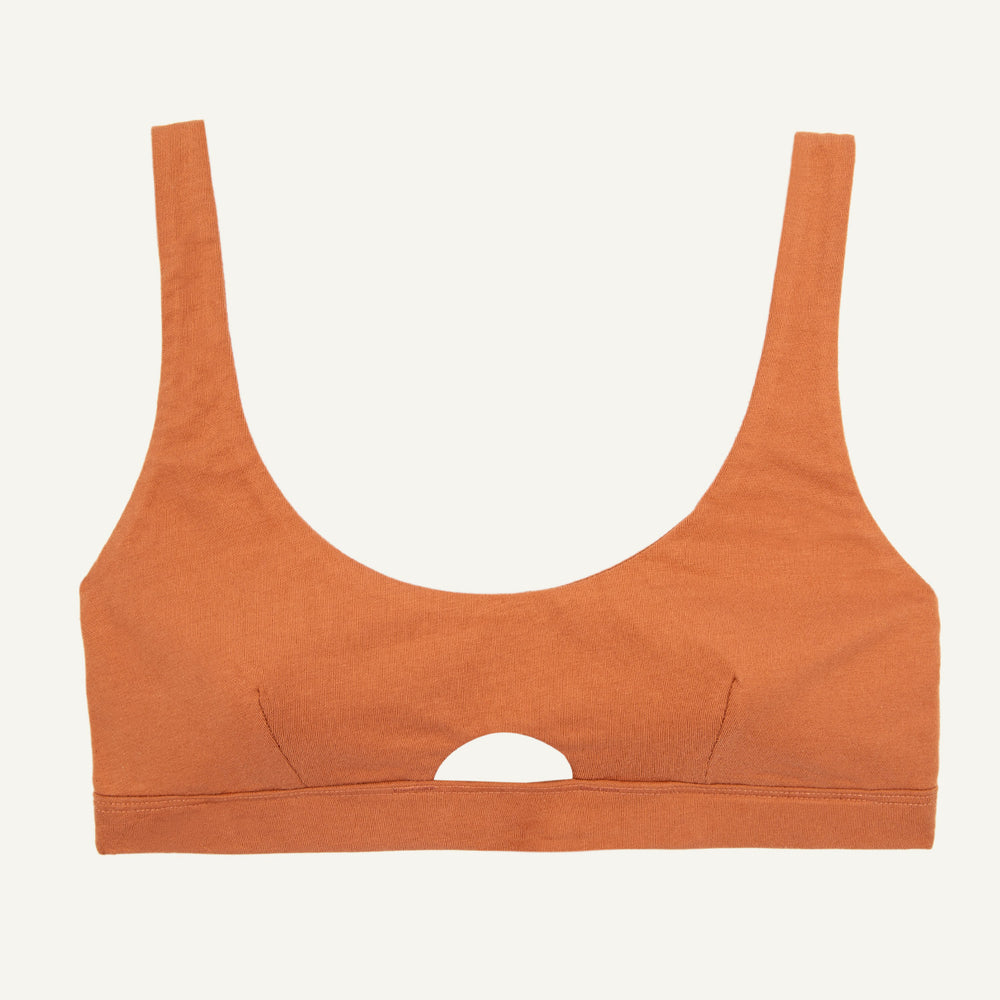 An organic cotton keyhole soft bra in spice orange color