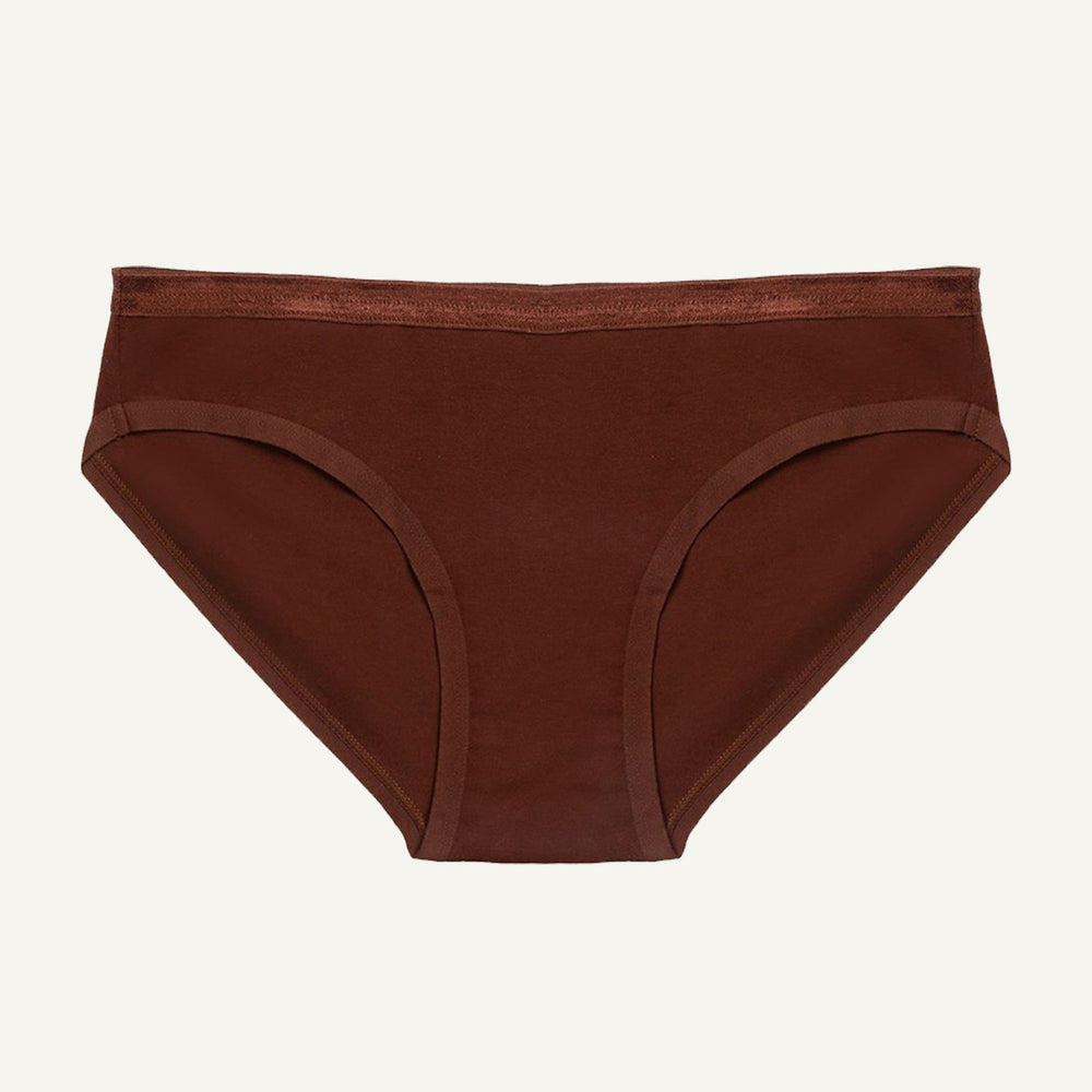 A low-rise organic cotton brief in cacao brown color, with a snug fit and minimal waistband.