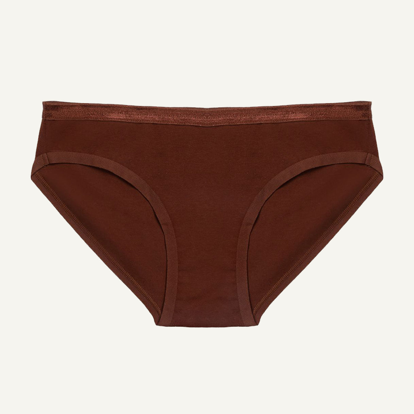 A low-rise organic cotton brief in cacao brown color, with a snug fit and minimal waistband.