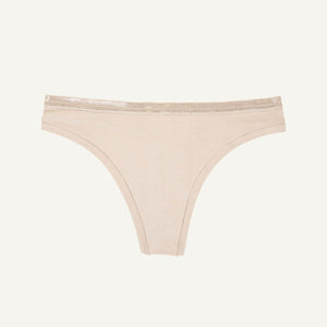 A low rise thong in stone beige color.