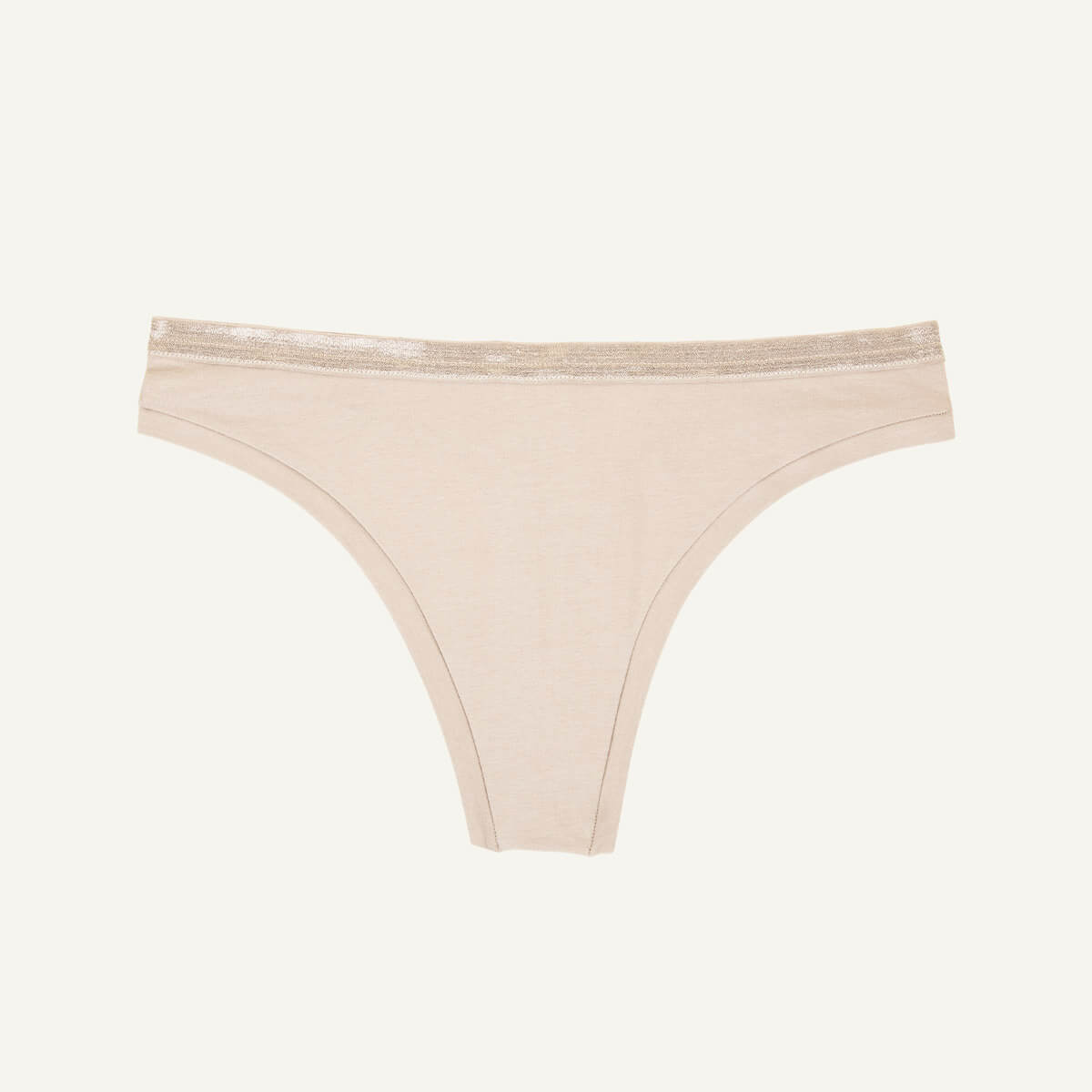 A low rise thong in stone beige color.
