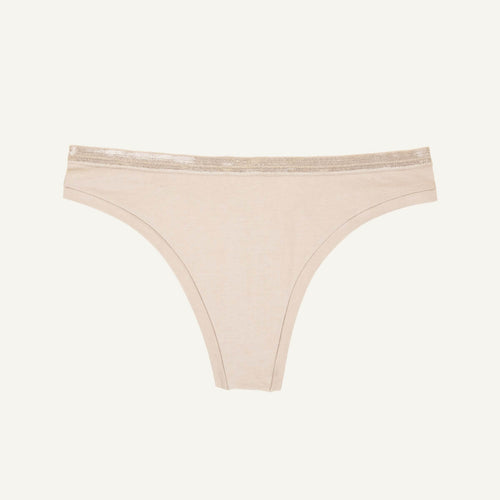 A low rise thong in stone beige color.