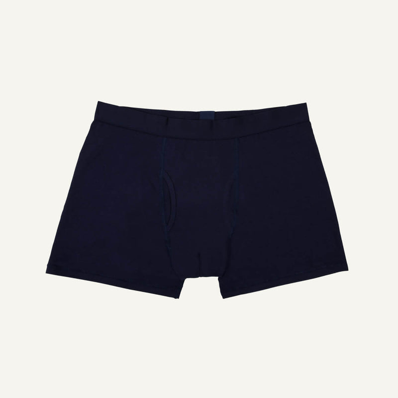 A pair of men's boxer briefs in marine blue color.