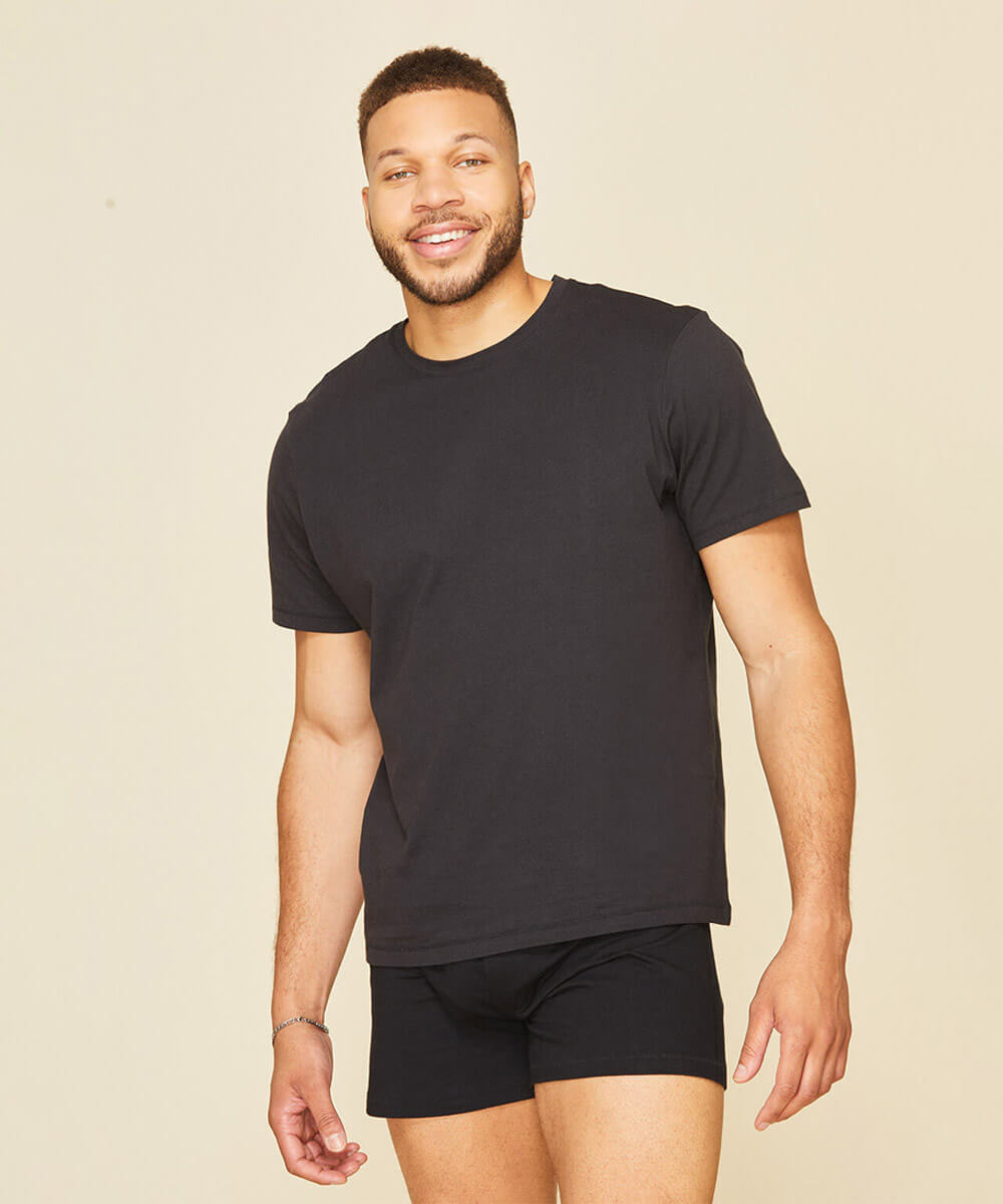 Man wearing the classic tee in graphite gray color.