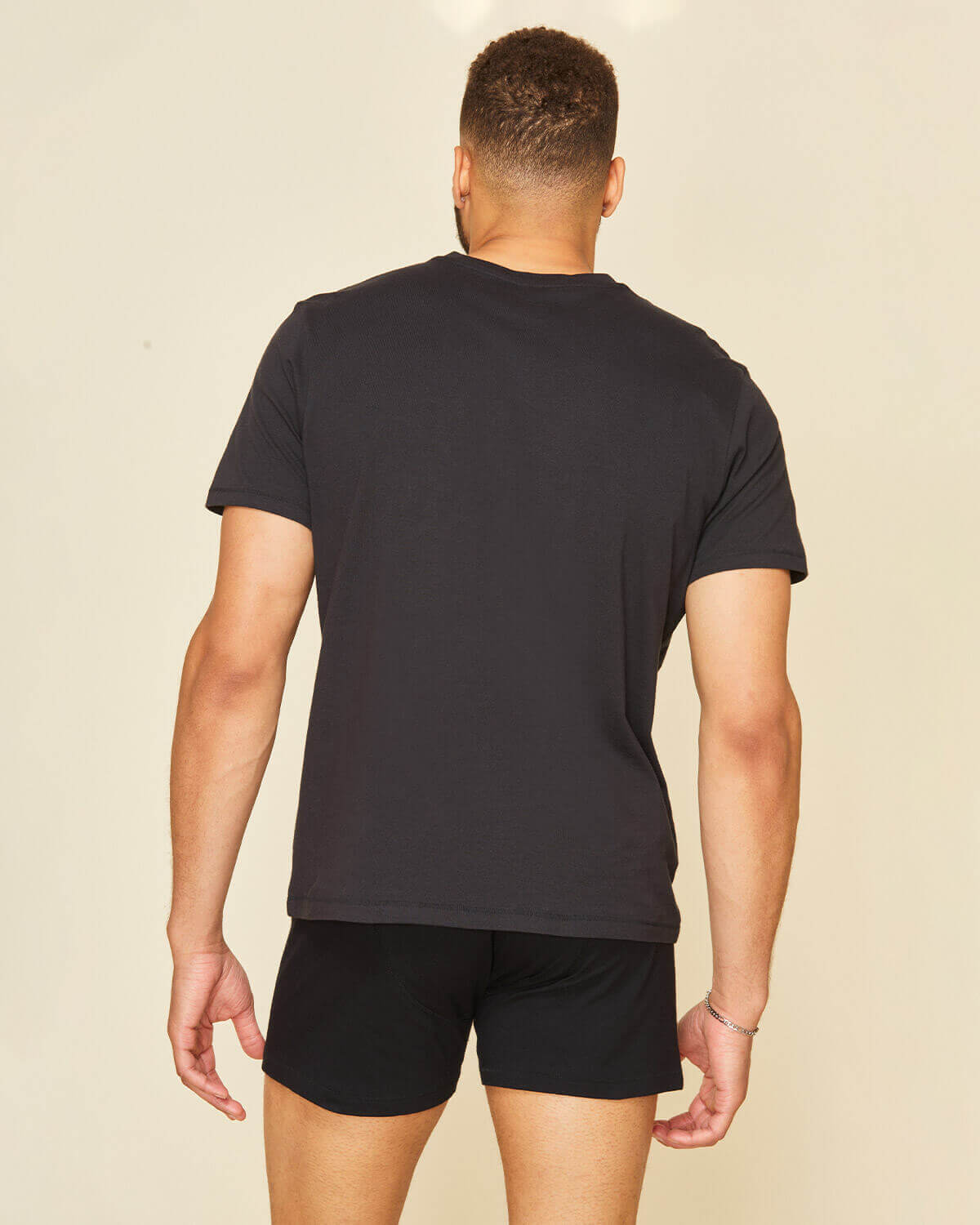 Man wearing the classic tee in graphite gray.