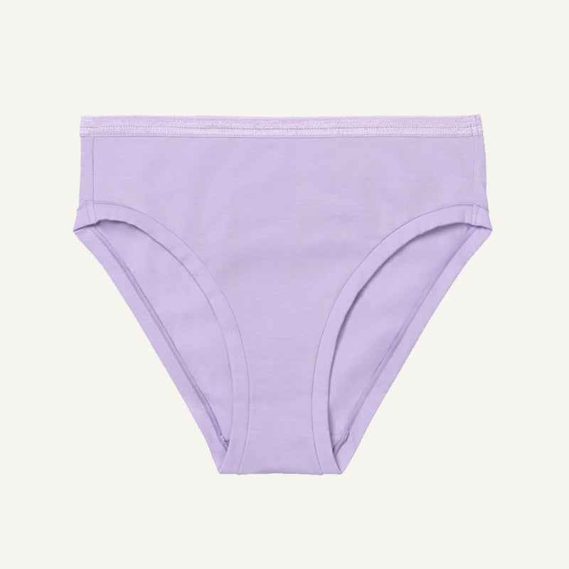 A mid-rise bikini brief in a petal light purple color with an elastic waistband.