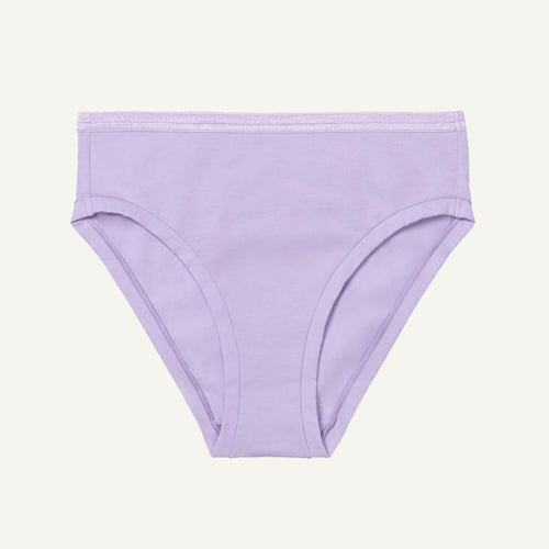 A mid-rise bikini brief in a petal light purple color with an elastic waistband.