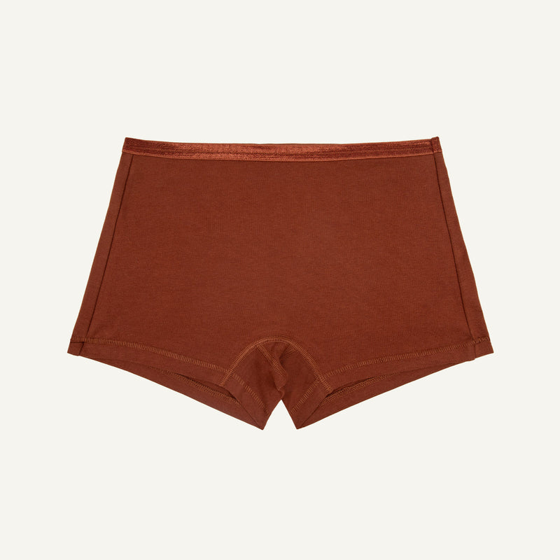 A cacao brown mid-rise boyshort style underwear made from organic cotton blend fabric.