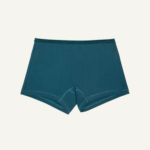 A pair of mid-rise shorties in meridian teal color.