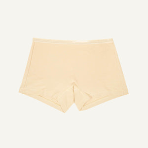 A pair of mid-rise shorties in wheat beige color.
