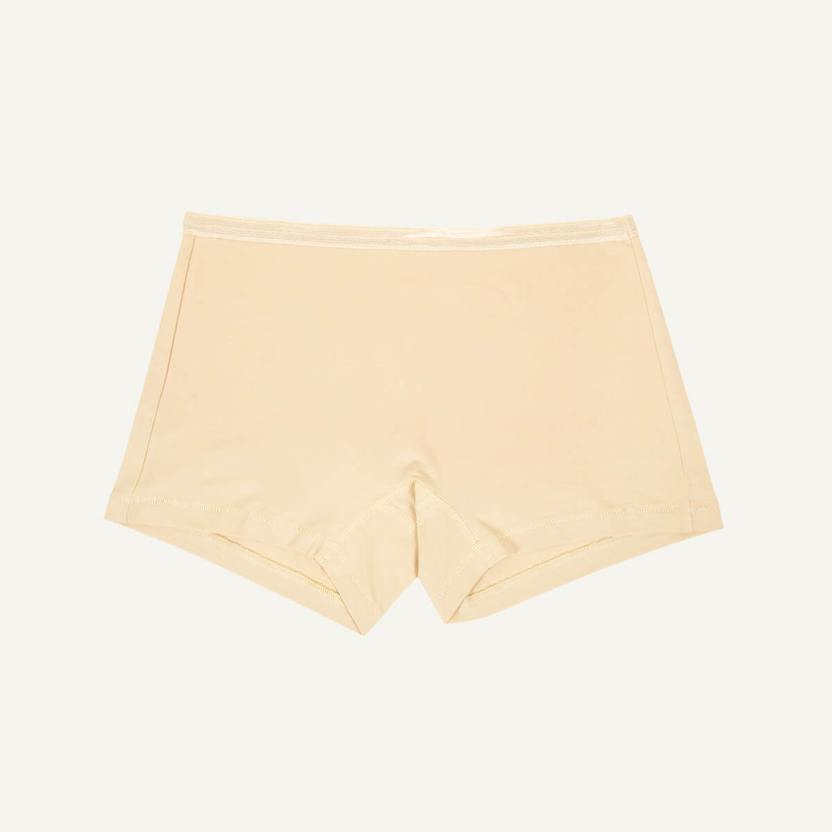 A pair of mid-rise shorties in wheat beige color.