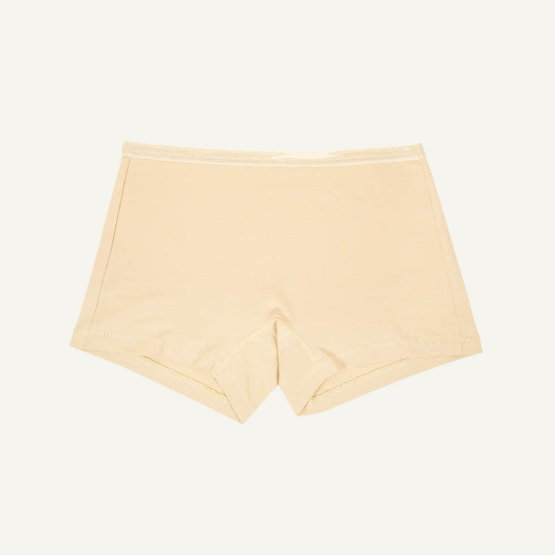 A pair of mid-rise shorties in wheat beige color.