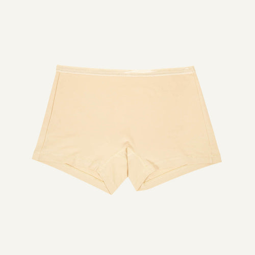 A pair of mid-rise shorties in wheat beige color.