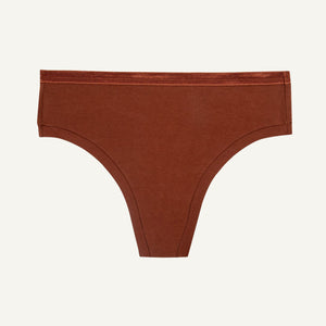 A mid-rise cacao brown thong underwear against a solid background.