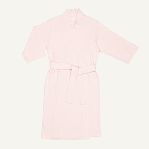 A light pink quartz organic cotton essential robe with 3/4 sleeves and a half-calf length.