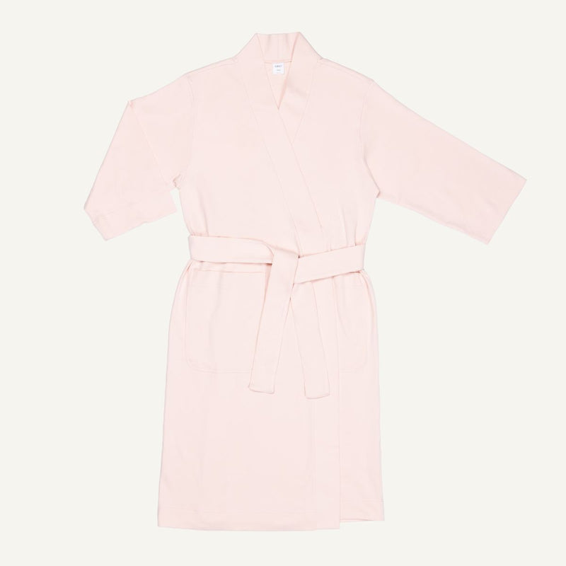 A light pink quartz organic cotton essential robe with 3/4 sleeves and a half-calf length.