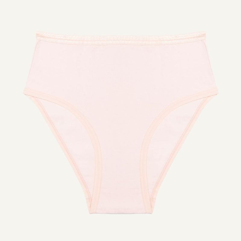 A high-waisted light pink quartz brief made from organic cotton.