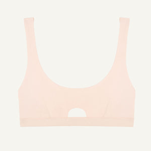A light pink quartz organic cotton keyhole soft bra without underwires.