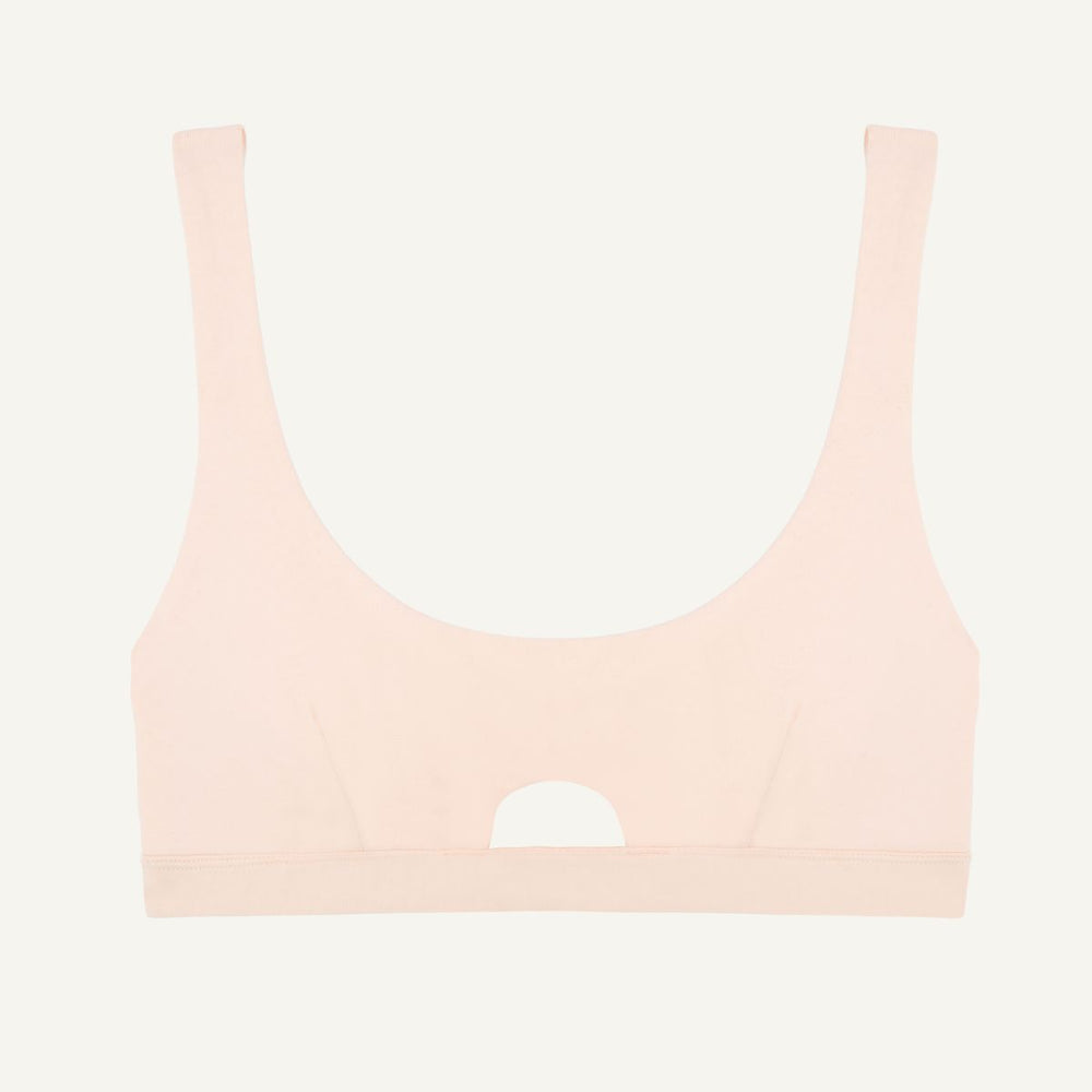 A light pink quartz organic cotton keyhole soft bra without underwires.