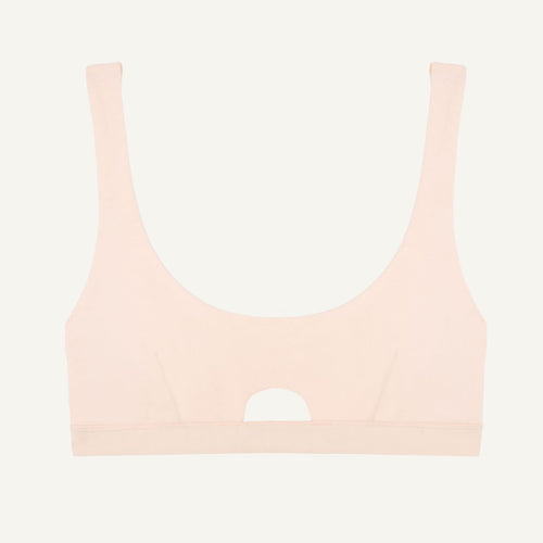 A light pink quartz organic cotton keyhole soft bra without underwires.