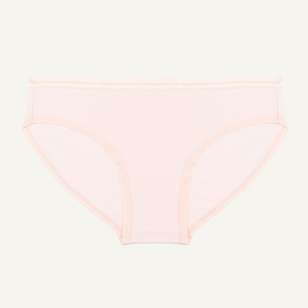 A low-rise brief in a light pink quartz color made from organic cotton.