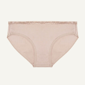 A low-rise brief in stone color made from organic cotton.