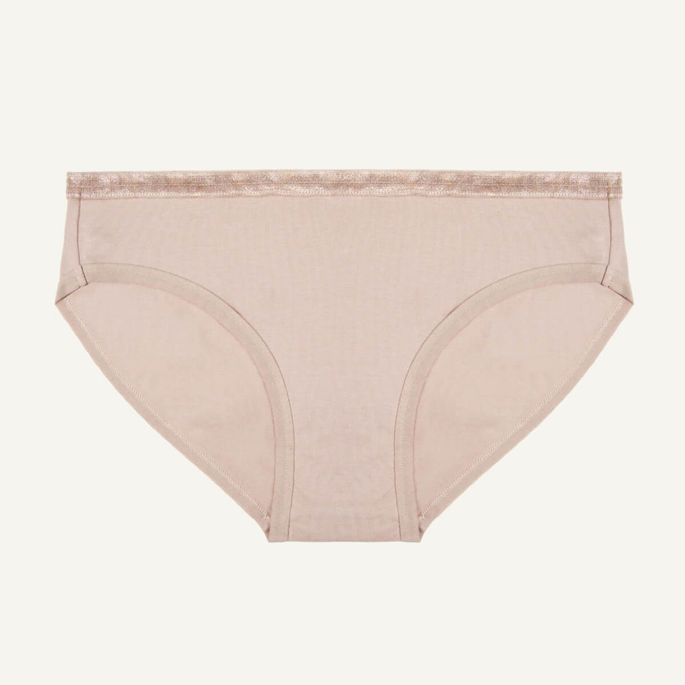 A low-rise brief in stone color made from organic cotton.