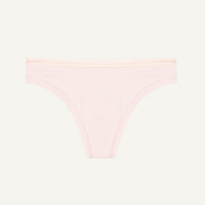 A low-rise organic cotton thong in a light pink quartz color.