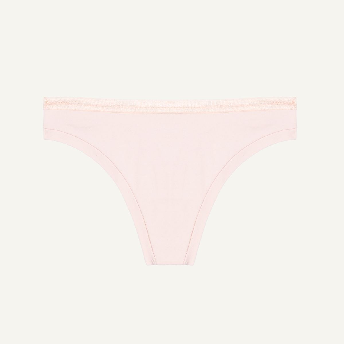 A low-rise organic cotton thong in a light pink quartz color.