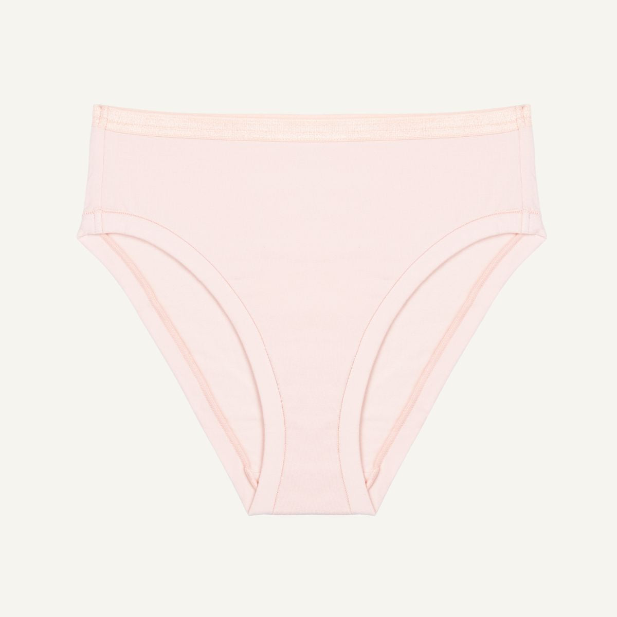 A mid-rise bikini brief in a light pink quartz color made from organic cotton.