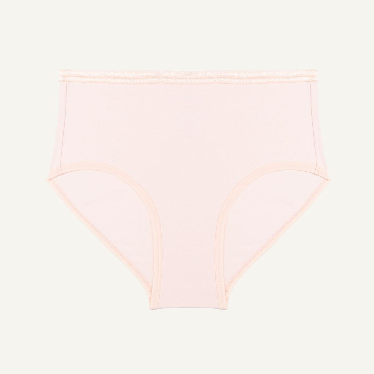 A mid-rise, organic cotton brief in a light pink quartz color, with an elastic waistband.