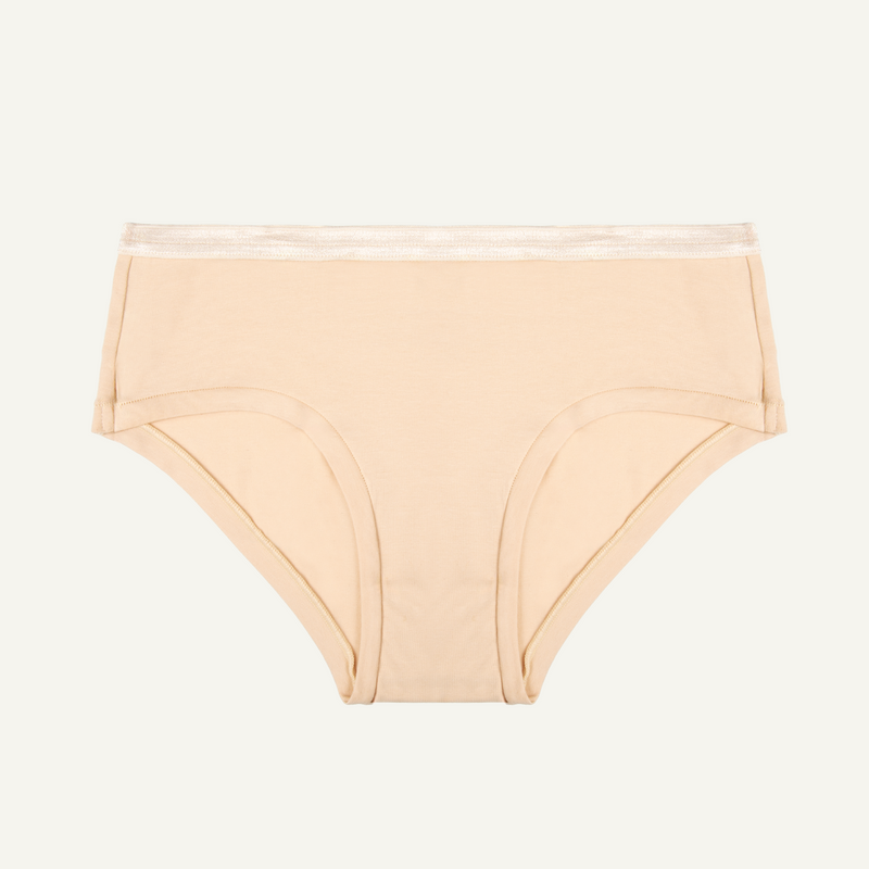 A wheat beige organic cotton mid-rise hipster underwear.
