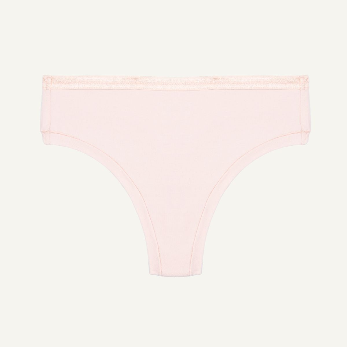 Organic cotton mid-rise thong in a quartz light pink color.