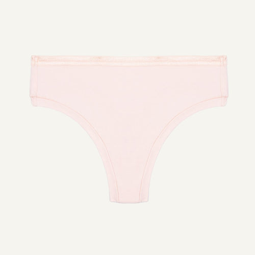 Organic cotton mid-rise thong in a quartz light pink color.