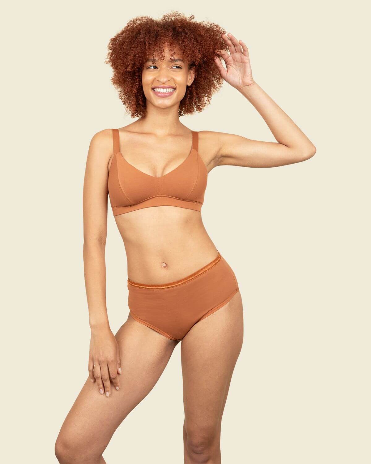 Subset organic cotton mid-rise brief and triangle soft bra in spice orange brown color.