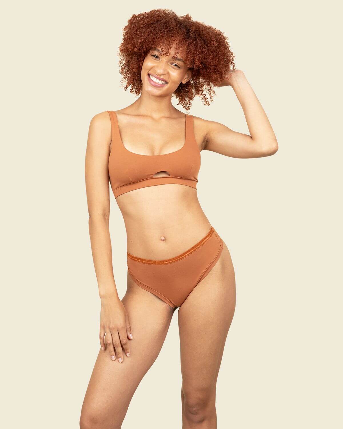 Subset organic cotton mid-rise thong and keyhole soft bra in spice orange brown color.