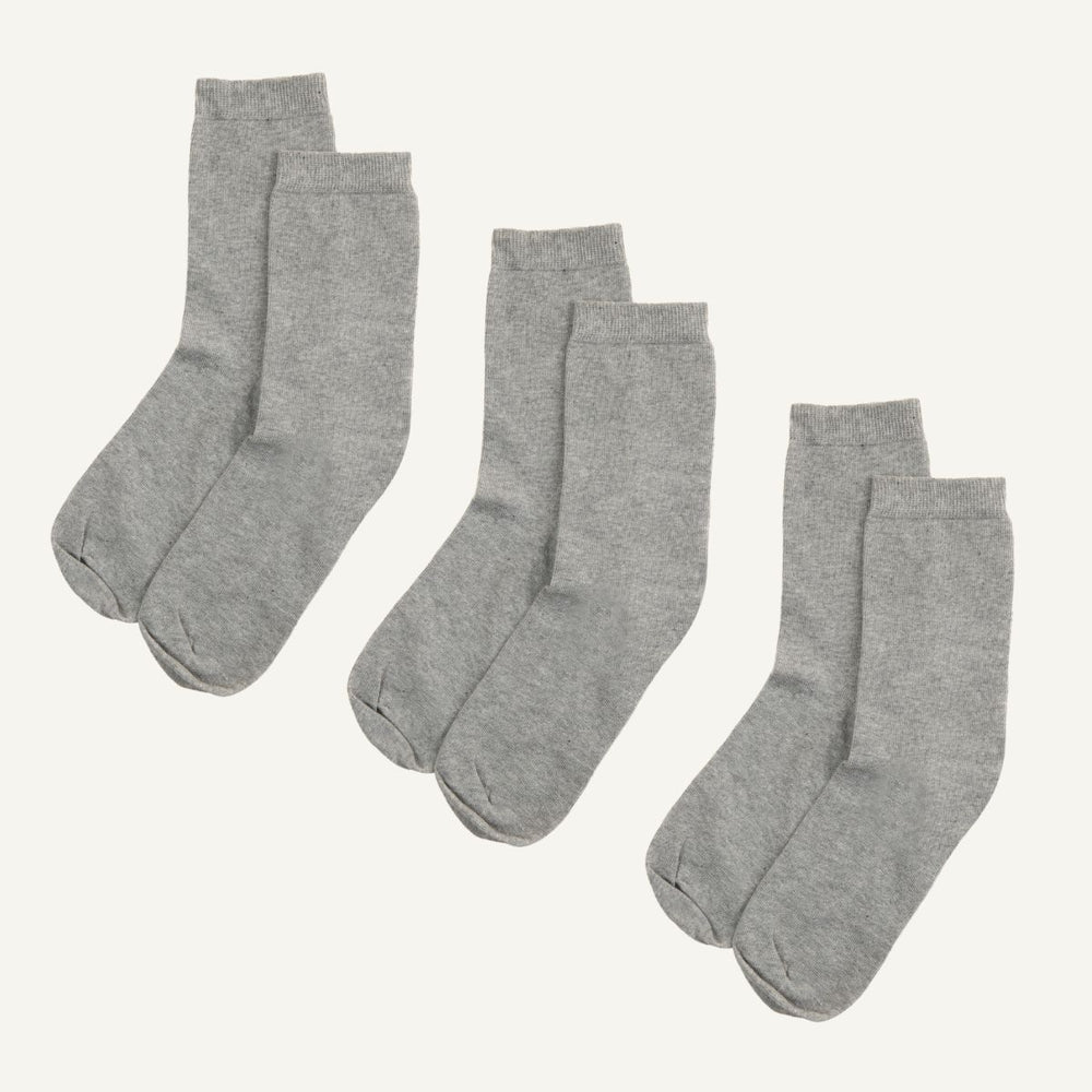 Three sets of gray organic cotton crew socks.