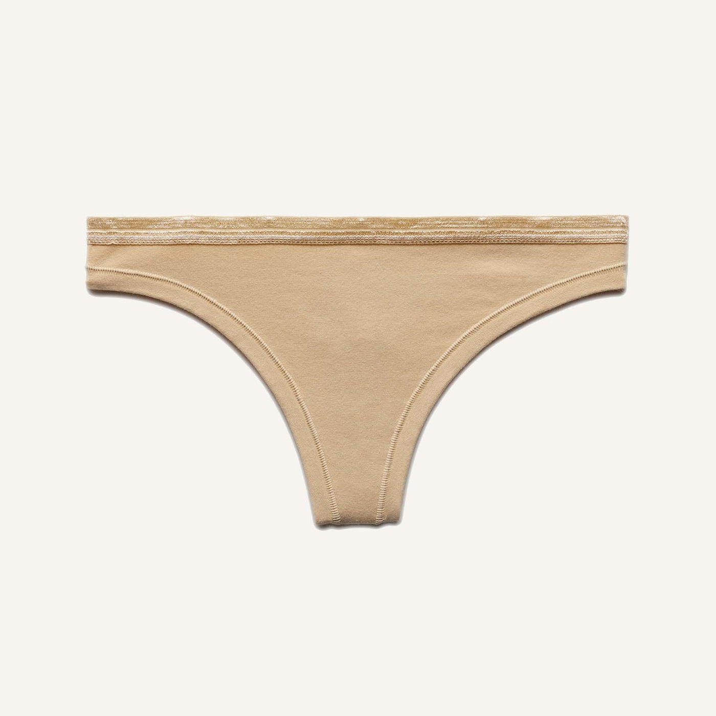 A low rise thong in wheat beige color.
