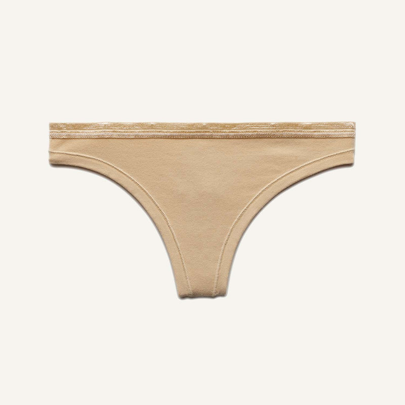 A low rise thong in wheat beige color.
