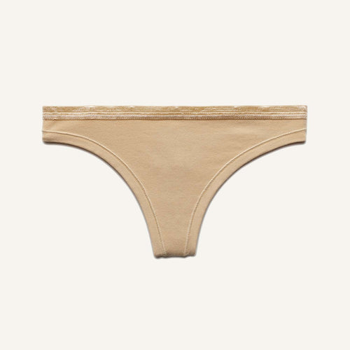 A low rise thong in wheat beige color.