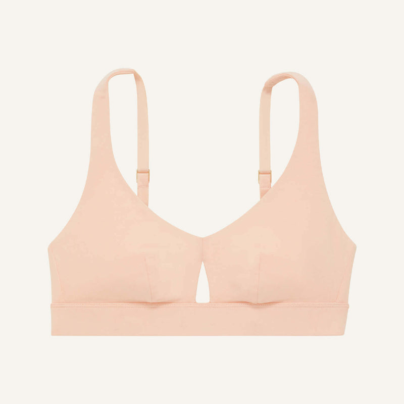 A keyhole bra in peach pink color.