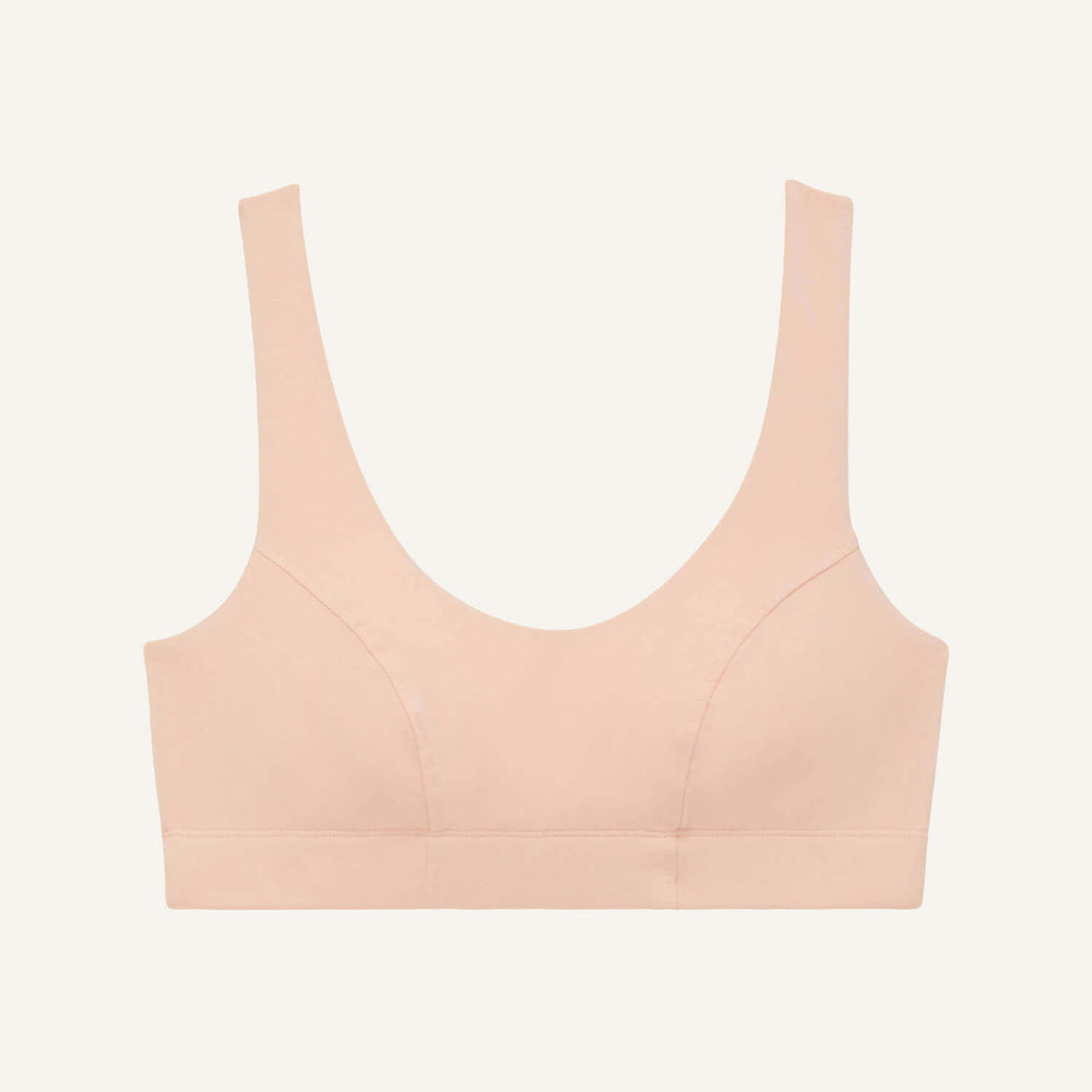 A scoop bralette in peach pink color.