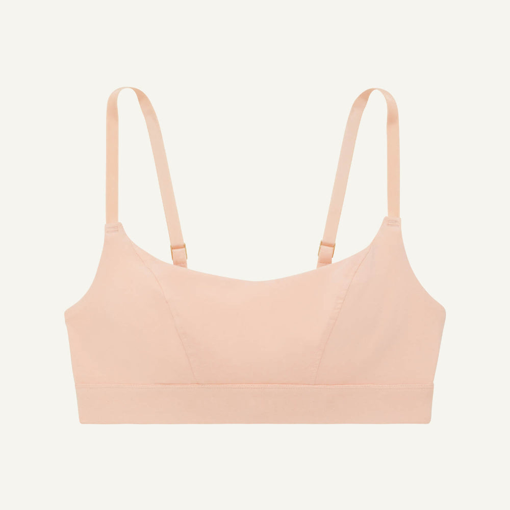 A tank bralette in peach pink color.