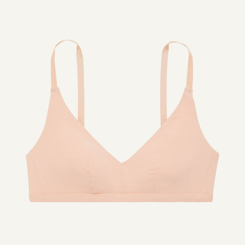 A triangle bra in peach pink color.